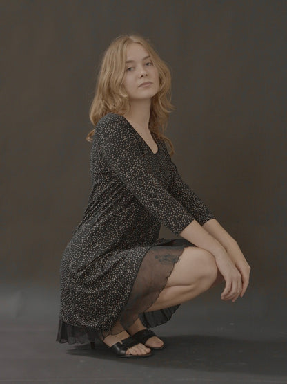 long-sleeve mini dress with sheer hem